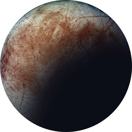 A gray planet with a slightly blurred blue edge and different hues of red scarred over the surface. There is a shadow over the planet that goes up from the bottom right. 